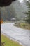 View, mountainous asphalt road with a sharp turn to the right, Aceh