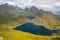 View of mountainous landscape with rainbow Lofoten, Norway