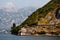 View of the mountainous shore and the lighthouse in the Mediterranean