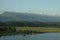 View of the mountains and the ancient lake. Voluminous clouds hang over the mountains. Lake Inkit in Abkhazia.