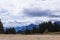 View of the mountains in Bulgaria with the tops of tall fir trees.