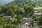 View of the mountains covered with forest and the chapel of St. Sarkis in the village of gosh, located near the town of Dilijan