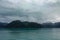 A view of mountains and icebergs in the Wrangell National Park outside of Hubbard Glacier Alaska from a cruise ship