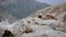 View of the mountains through a large stone