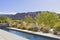 View of mountains from patio of luxury manor house with small pool