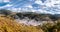 View of the mountains of Serrania de Ronda, Igualeja village and the chestnut forest in autumn. Trekking route, scenic, around the