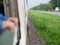 View of moving-pass-by natural wildflowers and weeds while traveling by train