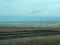 The view of the muddy road from a RV Sprinter Van stuck in the mud in the Wall, SD boondocking spot in Badlands National Park