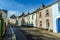 A view of multi-coloured houses in a typical street in Tenby, Pembrokeshire