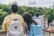 View of multicultural tourists standing with backpacks