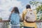 View of multicultural travelers standing with backpacks