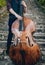 View of musician playing contrabass at the street.