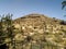 View of a Muslim graveyard typical of North African countries built on a hill.  Dirt graves.