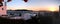 view of Mykonos, windmill and old port from a house at sunset