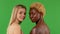 The view of the naked back of two young women turns and looks at the camera. Two young african american women and