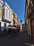 View of narrow alley in the old downtown of city Arucas in the north of Gran Canaria island, Spain on sunny day.