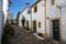 View of a narrow cobblestone street inside the walls of the Castle of the village of Nisa, Alentejo, Portugal