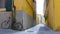 A view of a narrow yellow street of Pisa