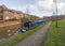 View of narrowboat moored on a British canal in urban setting