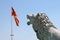 View of the national macedonian flag and lion sculpture. Skopje, North Macedonia.