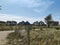 View of National park in North Germany with vacation home, dunes and path