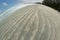 View of the natural dunes at the beach with wave sand pattern Beautiful background.