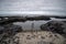 View of Natural sea pool Las Salinas de Agaete in Puerto de Las Nieves and coast cliffs. Gran Canaria, Spain