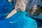 View of Navagio beach, Zakynthos Island, Greece. Aerial landscape. Azure sea water. Rocks and sea.