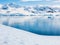 View from Neko Harbour to Andvord Bay with people kayaking, Arctowski Peninsula, mainland Antarctica