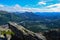 View of Nenana river valley from Mount Healy hike trail with blue sky with white clouds above. Denali National Park