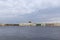 View of the Neva and the embankment in St. Petersburg, dome of St. Isaac`s Cathedral,  Seagull in the sky above the Neva