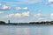 View of New Belgrade from the river Sava. A row of raft houses moored to the riverbank