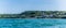 A view from New Quay Bay towards the Bach Quay beach and the outskirts of the town at New Quay, Wales