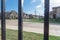View of nice and comfortable neighborhood through the fence