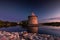 View of the night Pskov Kremlin near the city river on a summer clear day.