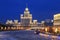 View of night winter Moscow with the Bolshoi Moskvoretsky bridge and high-rise building on Kotelnicheskaya embankment