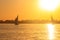 View of Nile river with sailboats at sunset in Luxor, Egypt