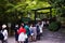 View of Nonomiya Shrine with crowd of young people waiting at front of Torii entrance gate