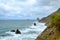 View of north of Tenerife, Canary island, Spain. Mountain green landscape with ocean coast and dark sharp cliffs.