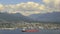 View of North Vancouver BC from Gastown in Canada with Moving Clouds Blue Sky and Water Traffic