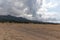 View of Northern Cyprus. The nature of the Mediterranean. A round bale of straw for animal feed. Forage for livestock. Cloudy