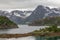 View of the norwegian fjords. green hills, snowy peaks