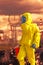 View of nuclear power plant and firefighter in a chemical protective hazmat suit