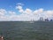 View of NY Harbor with distant skyline of NYC lower Manhattan