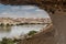 View of the oasis of the Namibe Desert, through the arch. Angola. Africa