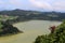 View from the observation deck at Lake Furnas and lone bush azaleas on the slope