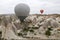 View from the observation deck of the village of GÃ¶reme on the flight of balloons over the valleys