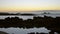 View on ocean and beautiful silhouette of rocks at sunset