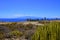 A view of the ocean, the desert and La Gomera island in Golf Costa Adeje, Tenerife, Spain.