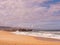View of the ocean and lighthouses on the beach in nazare, portugal